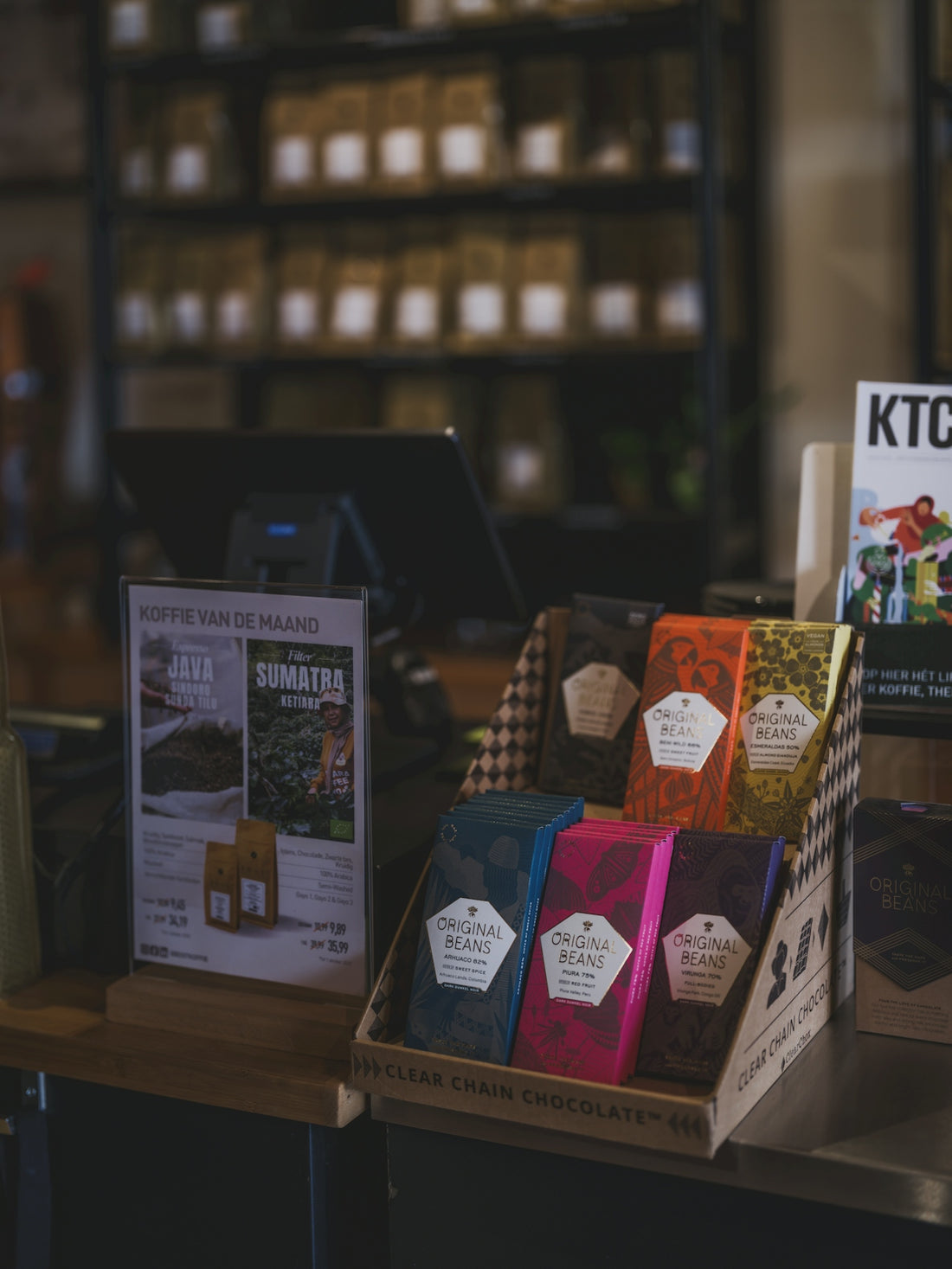 Colorful chocolate bars displayed at a counter