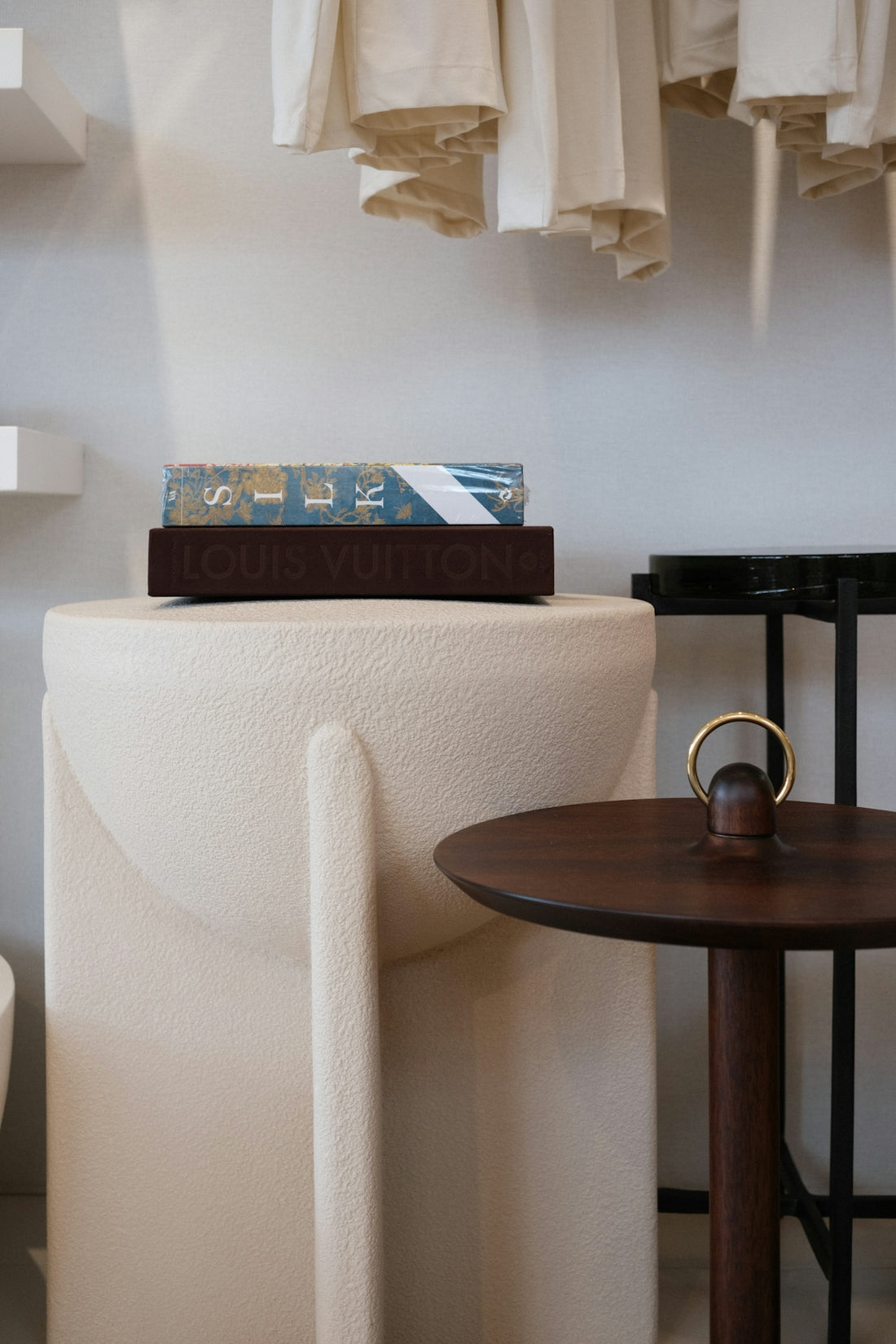 A book with louis vuitton on a pedestal