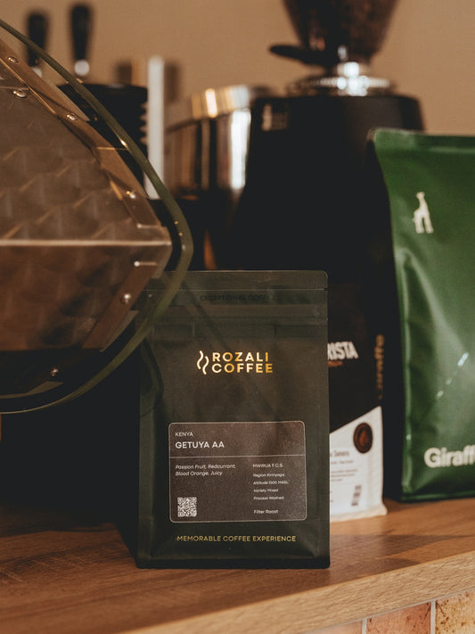 A bag of rozali coffee with coffee beans in background.