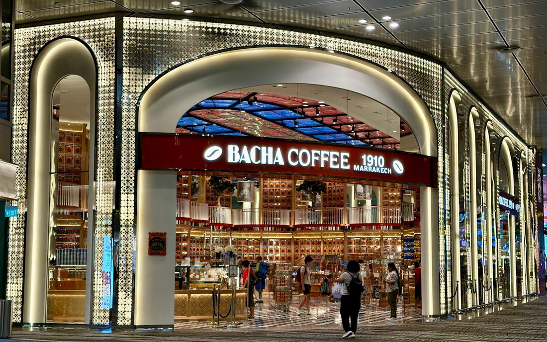 The exterior of a bacha coffee shop with illuminated arches.